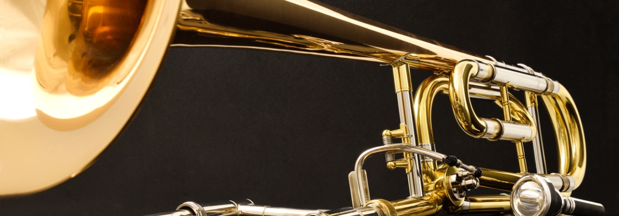 Trombone with transposer on a black table front view