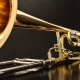 Trombone with transposer on a black table front view